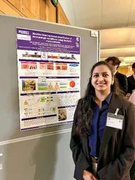 Agrima presenting her poster at STEM for Britain