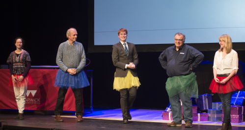 A group of academics demonstrating in tutus 