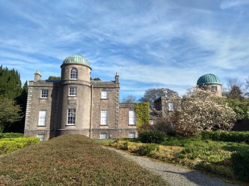 The Georgian Armagh Observatory, A square building with towers topped with domes which house telescopes