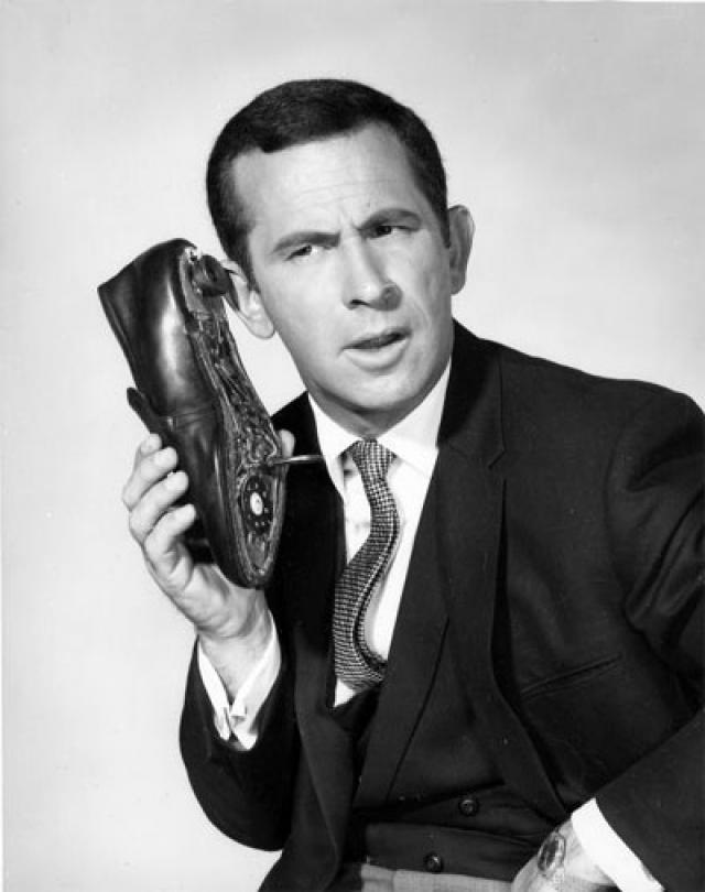 An image from Get Smart of the shoe-phone gadget that featured prominently in that series. image: https://en.wikipedia.org/wiki/Get_Smart#/media/File:DonAdams.jpg