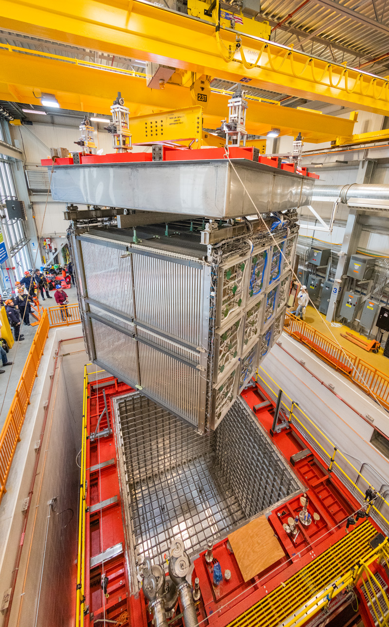 Detector being lowered into cryostat at Fermilab