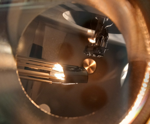 A glowing beam flux gauge inside an MBE chamber