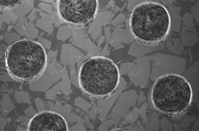 Laser machined pits in diamond