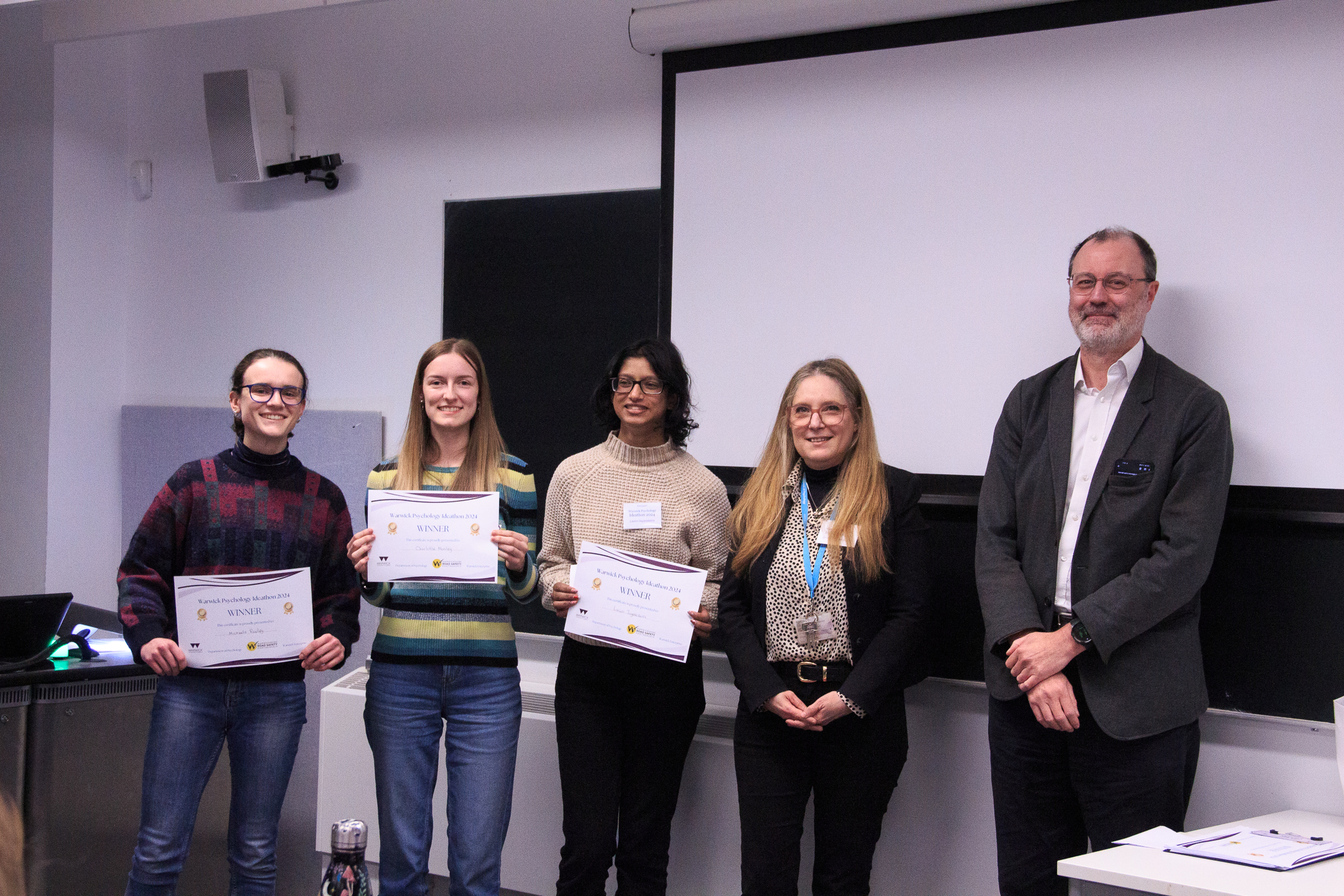 Winners of Psychology Ideathon 2024, Michaela Pawley, Charlotte Manley, and Lasini Jayasekera with Dr Gitit Kadar-Satat and Professor Derrick Watson