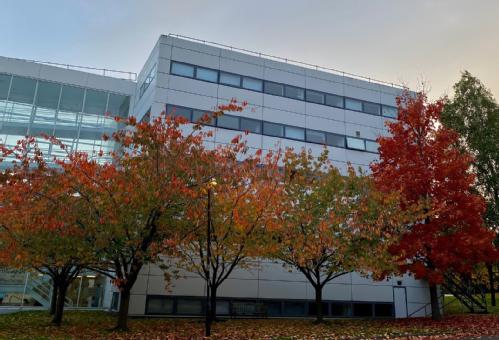 Humanities Building with autumn trees