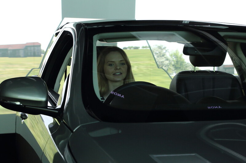 Woman driving in a simulator 