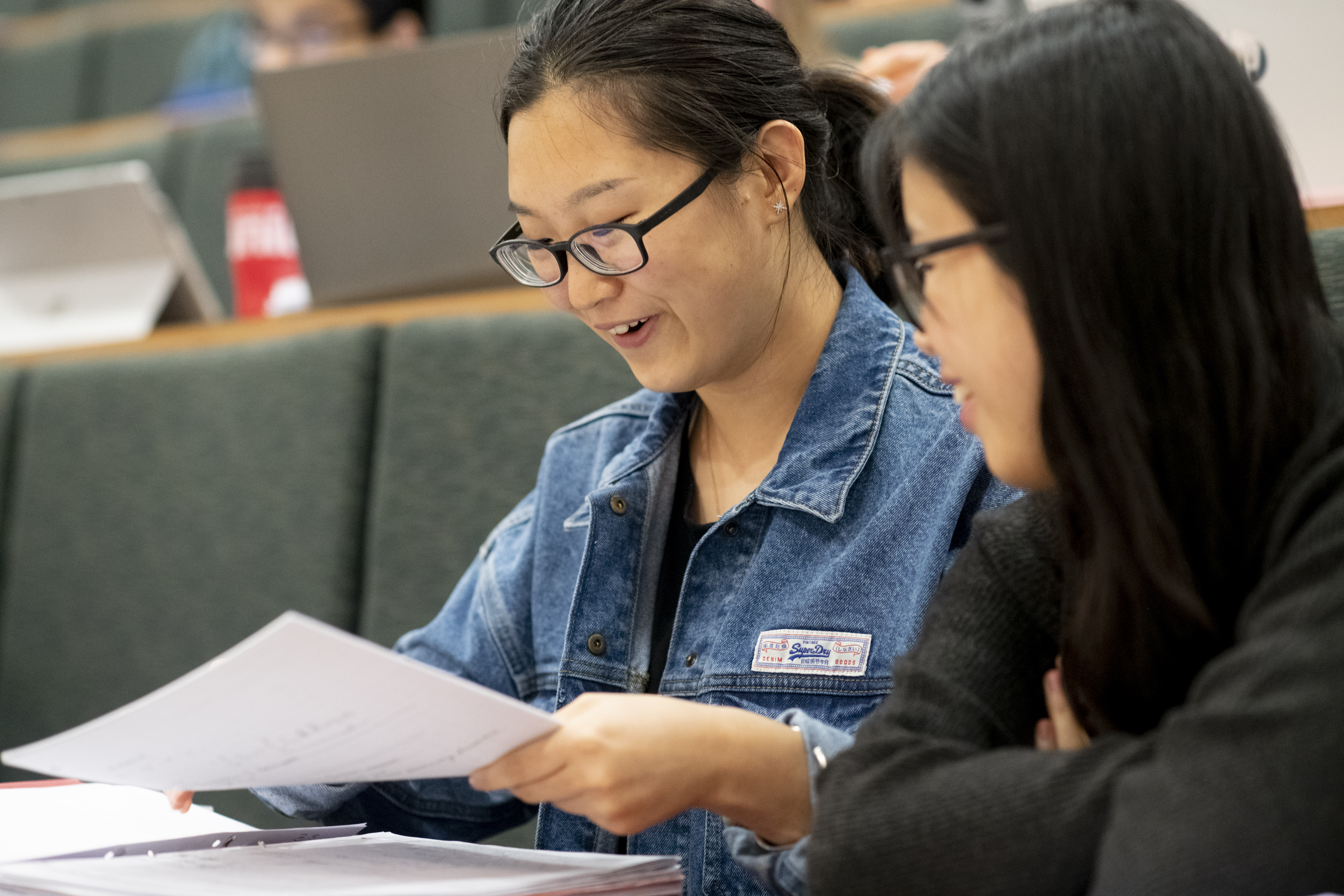 Students looking at paper