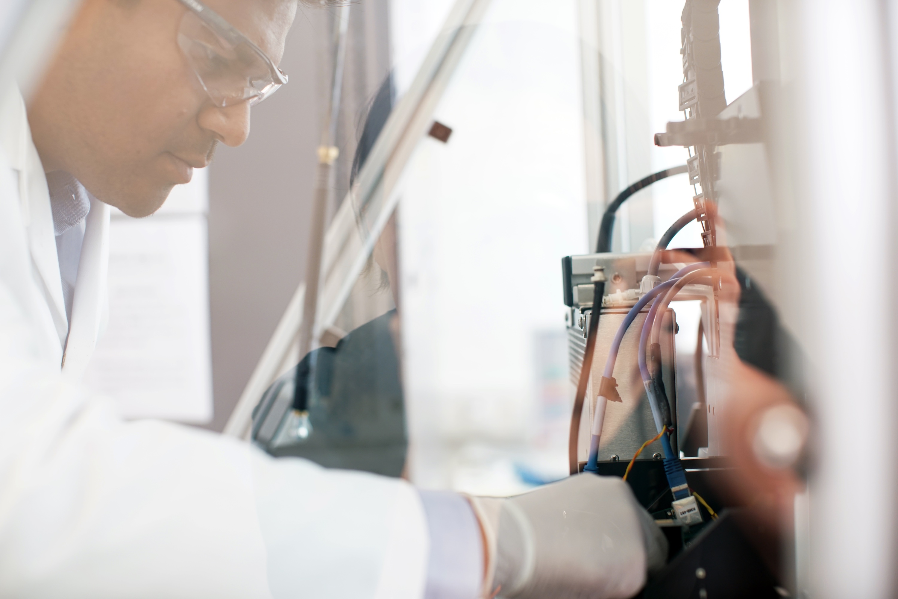 A person using a piece of engineering equipment.