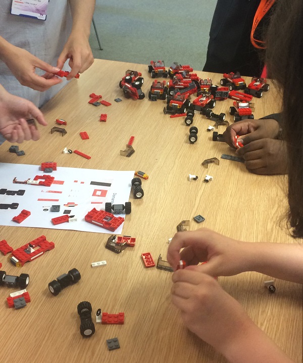 Students creating robotic parts