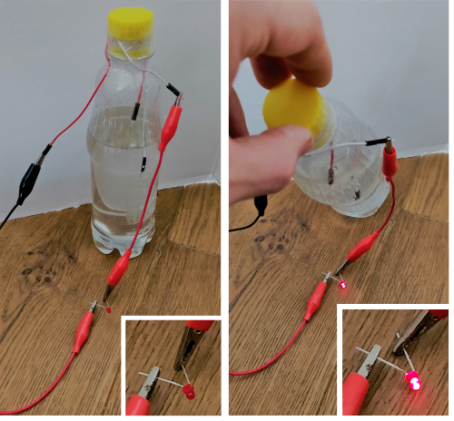 A low-technology tilt sensor made from a drinks bottle and two wires dangling just inside the bottle. One wire is always under water, the other is only in the water when tilted.