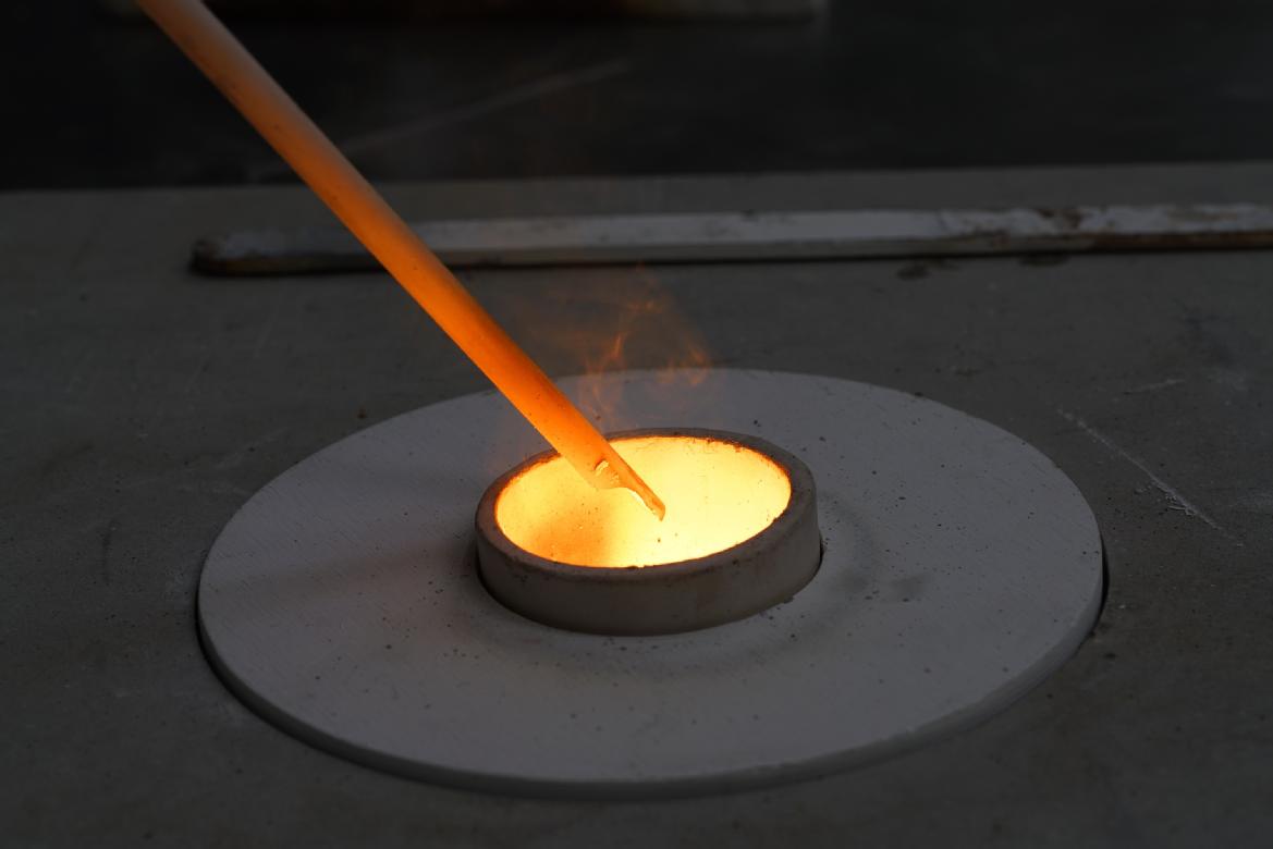 a picture of molten steel being poured into a mould