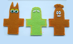 three felt finger puppets in green and brown with eyes stuck on