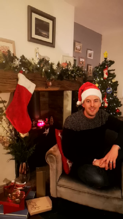 Phil is in a Christmas-y scene ready to talk about snowflakes