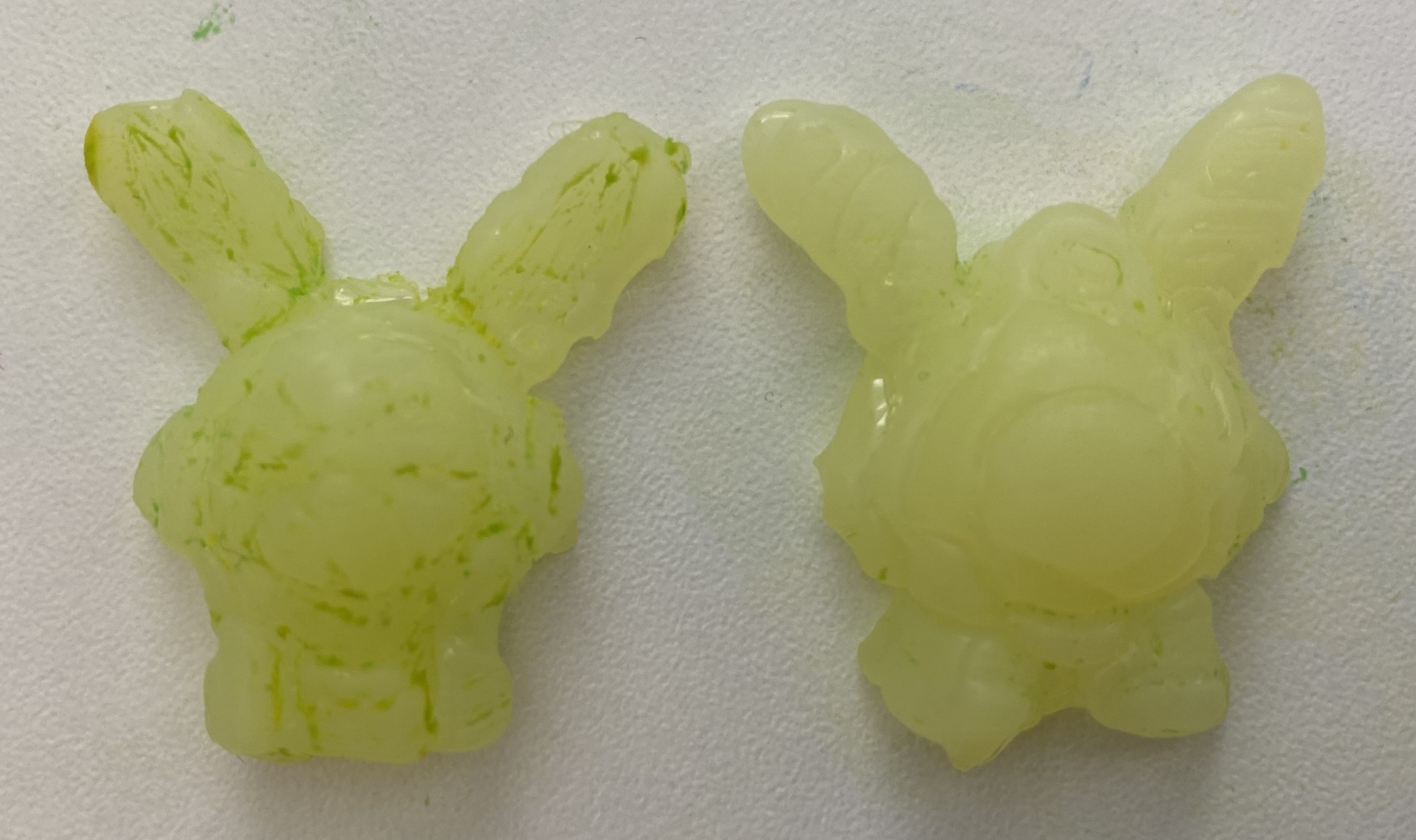 Two halves of the new rabbit toy model made from the glue 