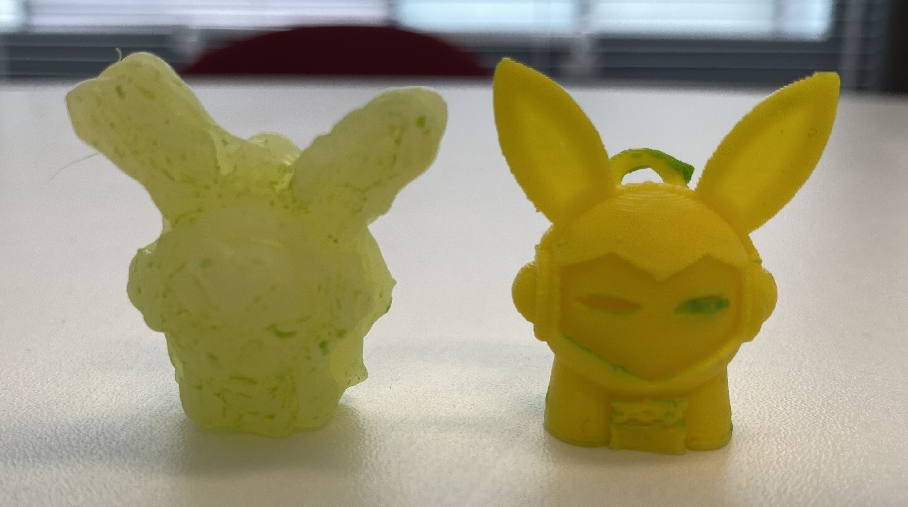 3d printed yellow rabbit next toy next to the toy version made out of glue using the mould