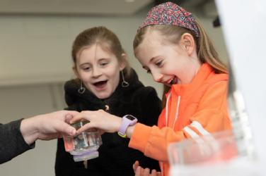 Picture shows two young girls taking part in British Science Week