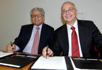 Lord Bhattacharyya and Barry Cohen sign the agreement