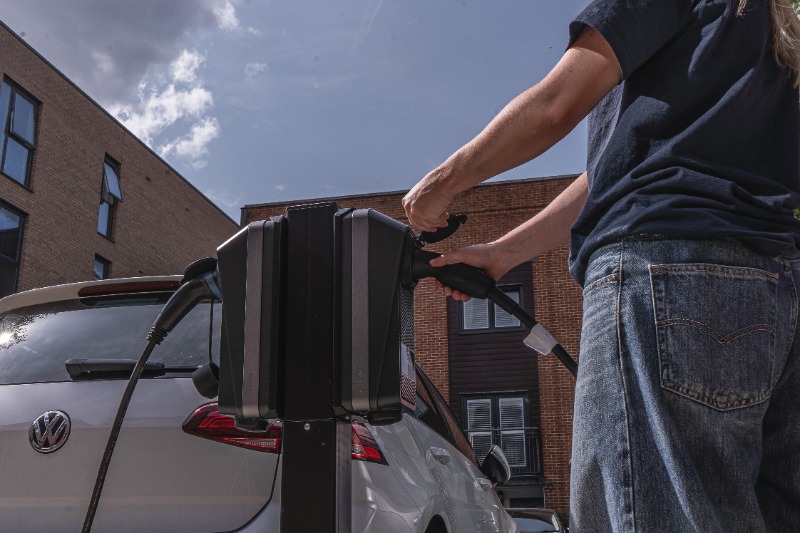 person using ev charge point