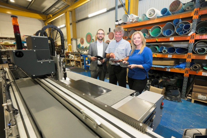 people standing in a factory