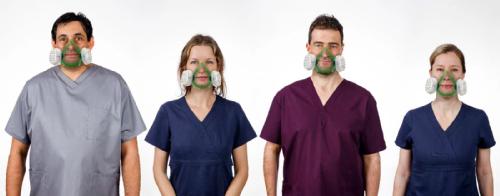 Four healthcare workers wearing face masks.