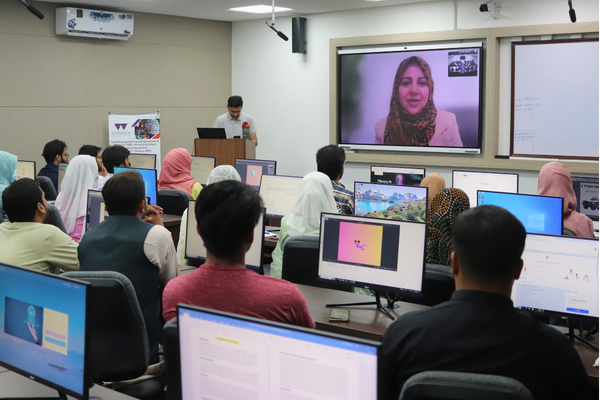 Classroom of students watch a presentation on screen