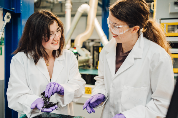 Two female research students in a lab environment