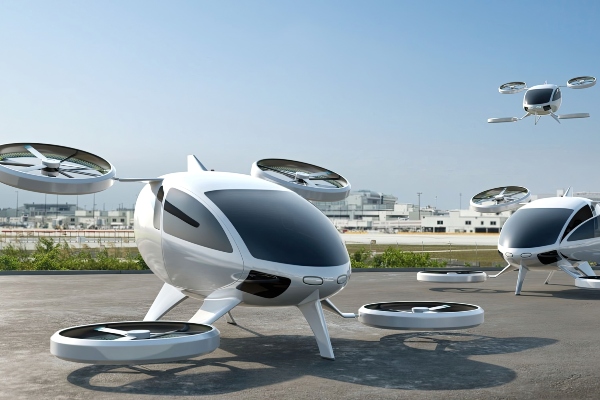 Artist impression of an eVTOL aircraft: a white, round aircraft with four propellers 