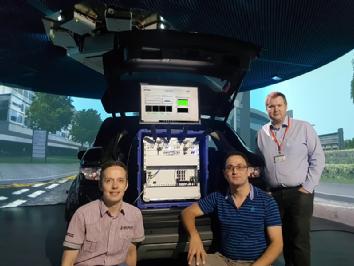 Dr Erik Kampert, Mr Karen Vardanyan and Dr Matthew Higgins install and commission the 5G NR Test UE inside WMG’s 3xD Simulator