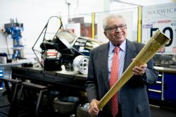 Professor Lord Bhattacharyya with Olympic torch