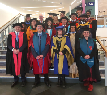 Picture shows Professor Robin Clark, Professor Gill Cooke and members of the WMG teaching team in their graduation robes