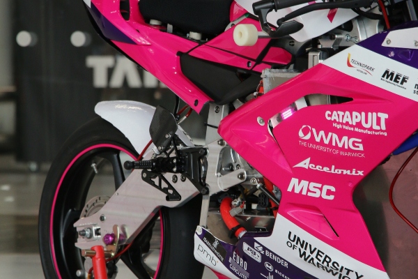 Close up of pink and white electric motorbike