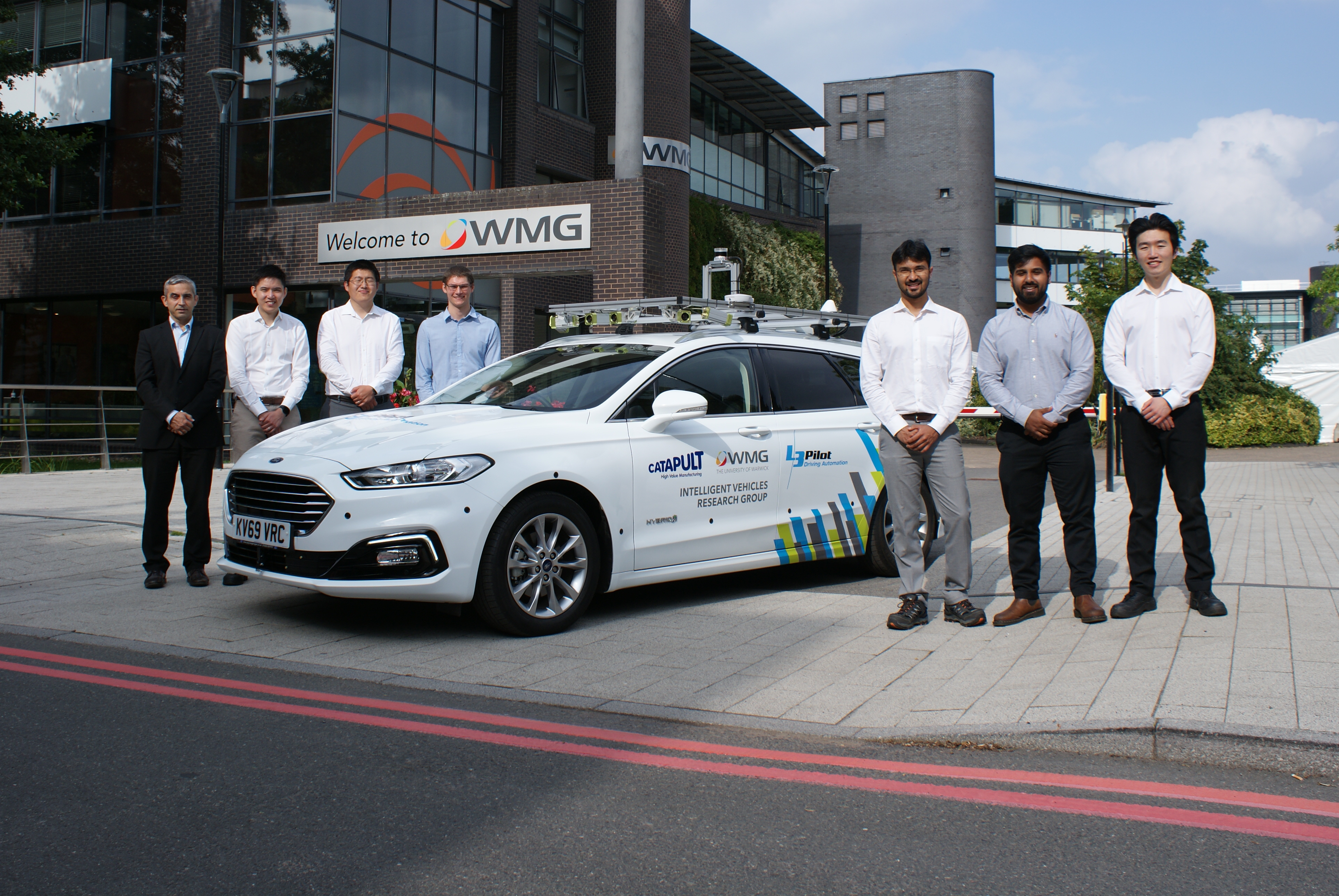 Promotional image of the final L3 pilot vehicle outside WMG, university of warwick 