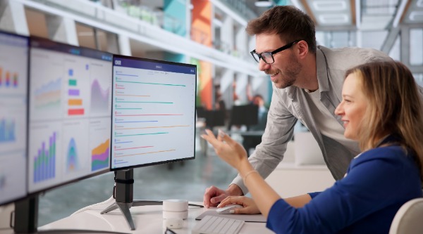 People looking at a computer