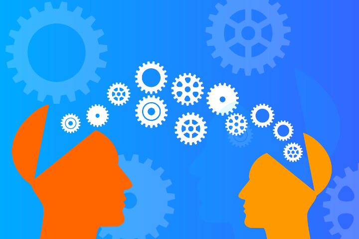 Two stylised heads with cogs moving from one to the other.