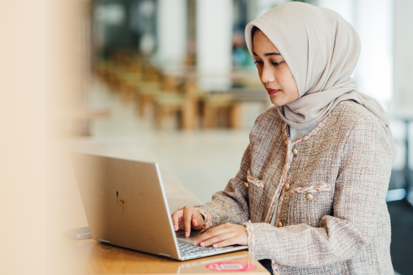 A business school student on her laptop