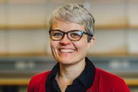 Carol Wild photo - woman wearing glasses and a red cardigan