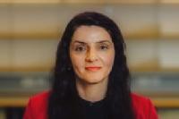 Holly Heshmati photo - woman with dark hair wearing red and black