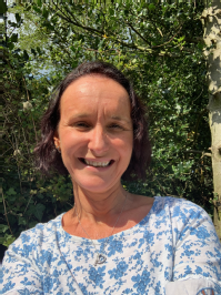 Nicola Crossley photo - woman with brown hair wearing a blue and white top