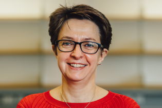 Vikki Armeson photo - woman wearing a red top and glasses