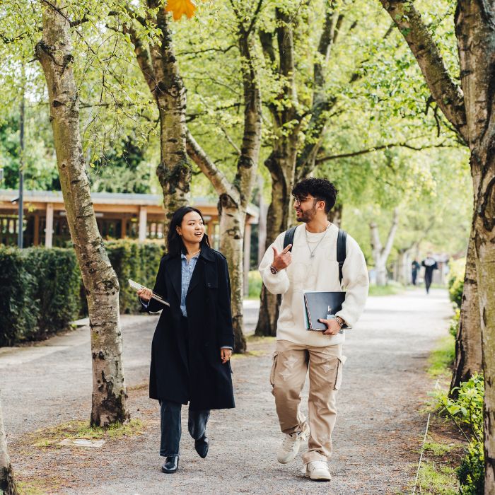 two students walking through campus