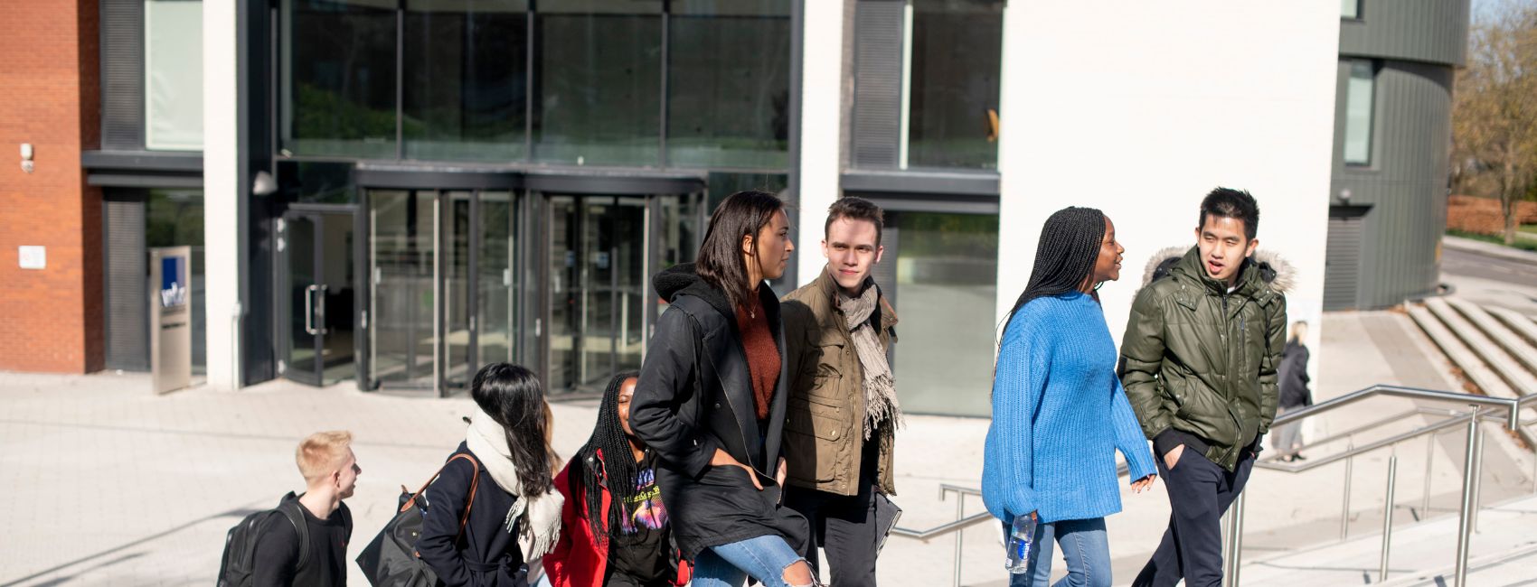 group of students walking through campus