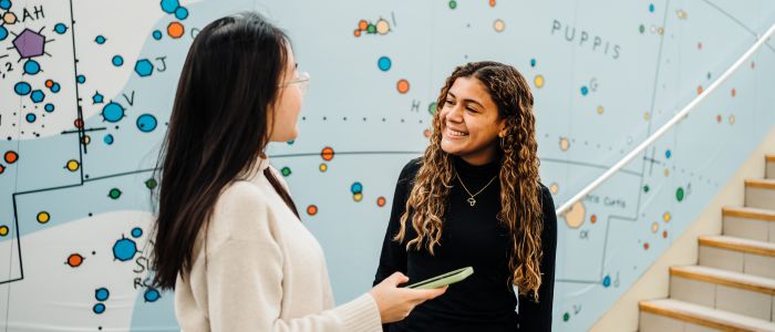 two women talking with each other