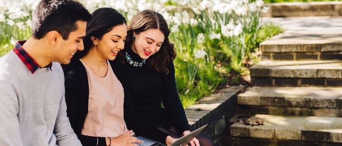 a group of people looking at a screen