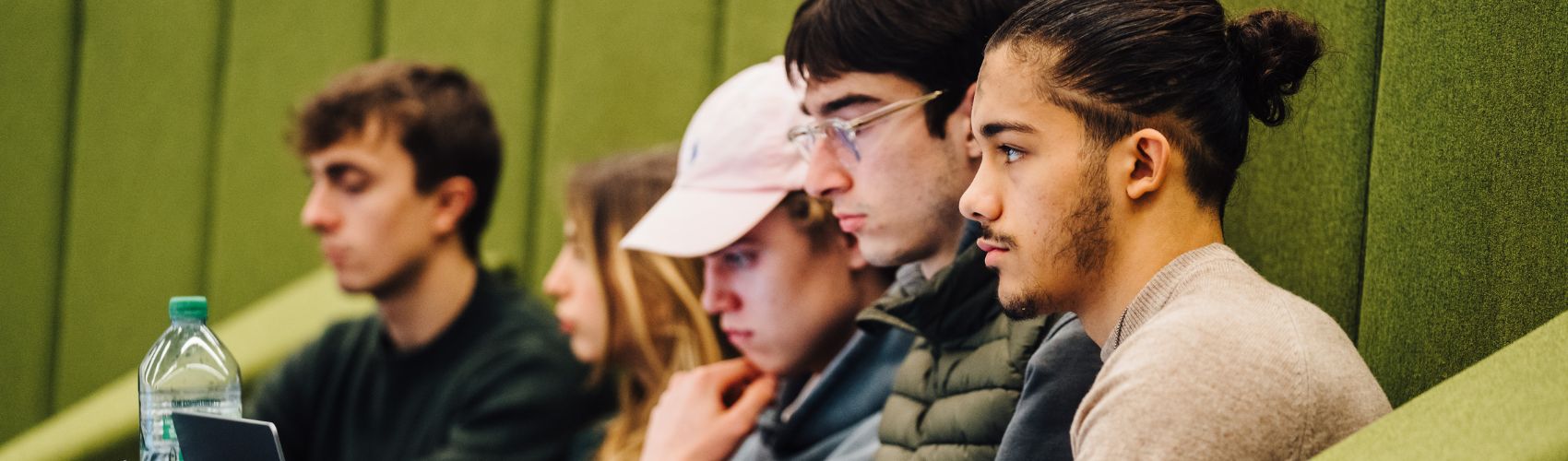 a group of people sitting in a row