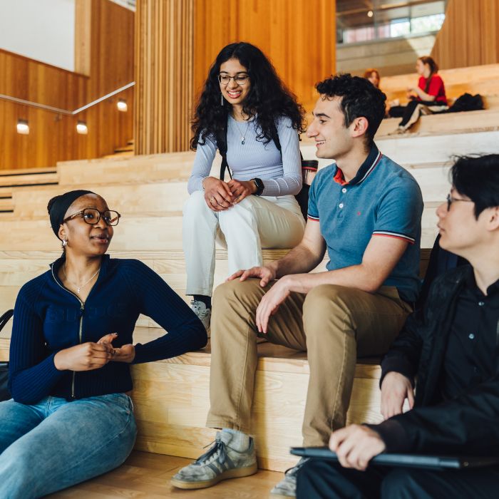 Two people looking at a sheet of paper