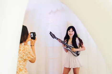 Student playing a guitar