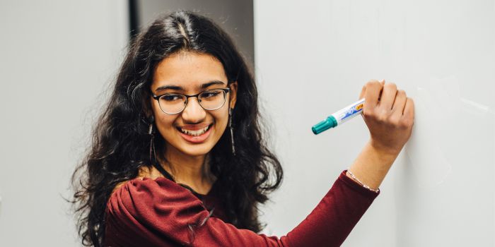 A person holding a marker