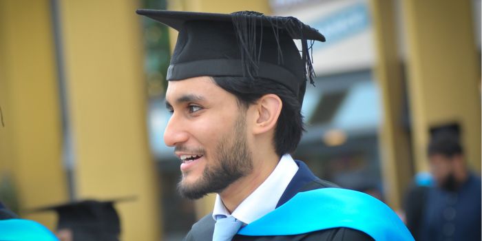 A person in a graduation cap and gown