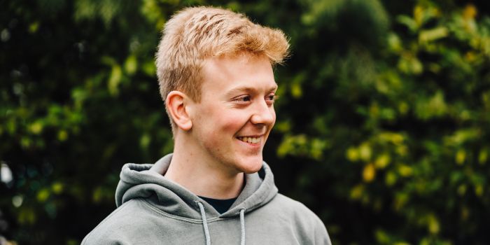 A headshot photo of a young male
