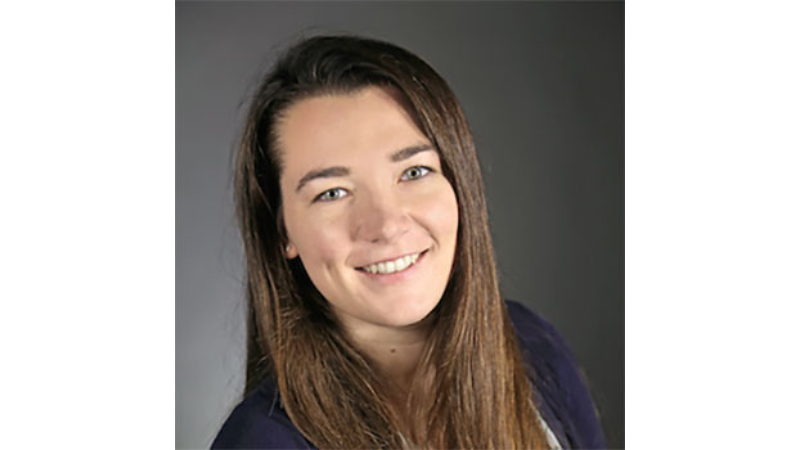 white female with long hair smiling